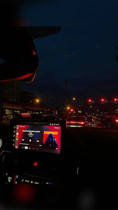 the dashboard of a car at night time