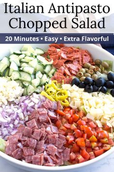 an italian chopped salad in a white bowl