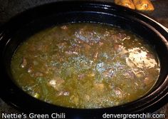 a pot filled with soup sitting on top of a stove