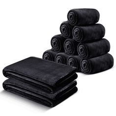 black towels stacked on top of each other