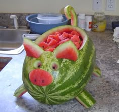 a watermelon carved to look like a pig