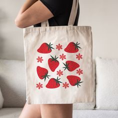 This Groovy Style StrawberryTote Bag is a stylish upgrade to reusable tote bags. This retro inspired canvas tote bag make a great reusable tote for yourself or as a gift tote.  ⚡ USA Fast Delivery. We Deliver Within A Week. ⚡ Our Tote Bags are made with 100% cotton sheeting. Add their reinforced handle stitching to the mix, and you got a reliable bag rich in both practicality and durability. These durable totes are crafted with a last technological DTG printer for a vibrant flawless finish. Tote Retro Pouch Bag As Gift, Retro Large Capacity Shoulder Bag As Gift, Retro Everyday Canvas Shoulder Bag, Retro Satchel Canvas Bag For Daily Use, Retro Canvas Satchel For Daily Use, Retro Shoulder Bag As Gift, Retro Shoulder Bag For Gift, Trendy Handmade Canvas Bag, Retro Pink Shoulder Bag As Gift