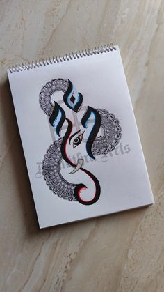 a spiral notebook with an image of a snake on it