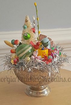 a bowl filled with assorted candies on top of a table