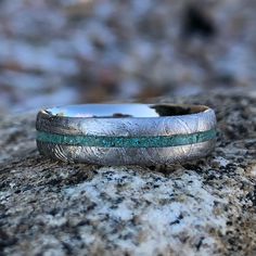 a close up of a ring on a rock