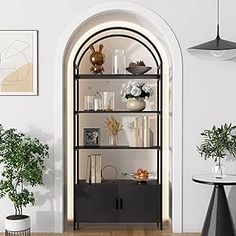 a living room filled with lots of furniture next to a wall mounted vase and potted plants