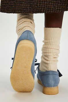 A timeless classic returns: these moccasins from Clarks feature the same details you know and love from the original style. **Features:** Slip-on style, suede uppers, round toe, mocc stitching, EVA midsole, natural rubber crepe sole, 2-eyelet lace-up closure, branded fob **Why We | Clarks Wallabee Moccasins at Free People in Blue, Size: US 9 Suede Moccasins With Vibram Sole And Round Toe, Winter Suede Moccasins With Round Toe, Casual Suede Moccasins With Vibram Sole, Casual Suede Moccasins With Rubber Sole, Suede Moccasins With Cushioned Footbed And Moc Toe, Winter Suede Moccasins With Rubber Sole, Spring Low-top Suede Moccasins, Winter Loafers With Rubber Sole And Round Toe, Classic Suede Flat Heel Moccasins