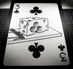 a playing card with a piece of cheese in the middle and four of spades on it