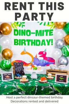 a dinosaur themed birthday party with balloons and decorations