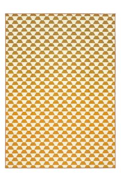 an orange and white rug with geometric shapes