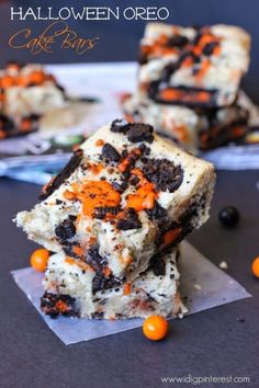 halloween oreo cookie bars stacked on top of each other with orange and black candies