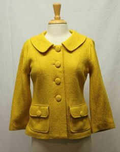 BB Dakota  Saffron Sophisticate Coat  Size:  10 (see measurements) Material:  50% wool, 50% rayon. 100% polyester lining Color:  Yellow Condition:  Excellent with one extra button included  Measurements (taken flat, across front) Bust --- 17 3/8"   Waist ---  16 1/4"   Sleeves --- 19.5"   Shoulder --- 15.5"    Length ---  21 3/4" (from back neck seam center down to hem)     Please also refer to the expandable photos for detailing/style Check  measurements for best fitting    ******************** Fitted Yellow Outerwear For Office, Fitted Yellow Outerwear With Lapel Collar, Elegant Yellow Outerwear With Pockets, Fitted Mustard Outerwear For Work, Chic Mustard Outerwear For Work, Chic Tailored Yellow Outerwear, Classic Fitted Yellow Outerwear, Mustard Fitted Fall Outerwear, Yellow Fitted Button-up Outerwear