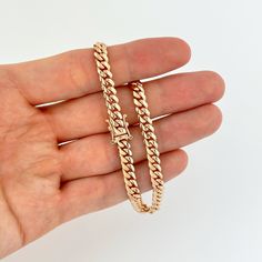 Elevate your style with this exquisite 5mm 14k Rose Gold Miami Cuban Bracelet, skillfully crafted in Italy. Made from genuine 14k rose gold, this bracelet features solid links that exude durability and luxury. The Miami Cuban link design is bold and eye-catching, making it a statement piece that adds a touch of elegance to your wrist. The 5mm size strikes the perfect balance between boldness and wearability, making it suitable for both everyday wear and special occasions. The Italian craftsmansh Rose Gold Vvs Clarity Bracelet, Luxury Rose Gold Cuban Link Bracelets, Rose Gold Bracelet With Solid Link As A Gift, Classic Rose Gold Tarnish-resistant Bracelet, Luxury Rose Gold 14k Tennis Bracelet, Classic Rose Gold Bracelets With Solid Link Construction, Classic Rose Gold Link Bracelets, Luxury Rose Gold Tarnish-resistant Bracelet, Formal 14k Rose Gold Chain Bracelet