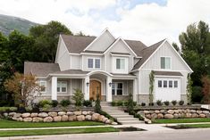 a large white house with landscaping around it