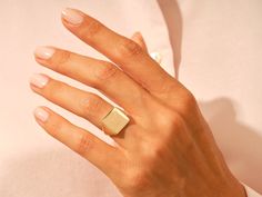 Our Personalized Gold Square Signet Ring is made from solid 14k or 18k gold, making it a timeless way to pass down family traditions across generations. Initials can be selected from an extensive list of options, and any symbols or designs can be added for that extra personal touch. Features Available Materials: 10k, 14k, 18k GoldAvailable Colors: Yellow, White, RoseAvailable Sizes: 6 mm, 8 mm, 11 mm, 13 mmReady to Ship: 3-5 Business Day Timeless Rose Gold Signet Ring For Anniversary, Timeless Polished Rose Gold Signet Ring, Timeless Rose Gold Signet Ring With Polished Finish, Everyday Rose Gold 14k Stamped Signet Ring, Timeless Rose Gold Signet Ring, Timeless Rose Gold Signet Ring For Wedding, Timeless Rose Gold Open Signet Ring, Modern Tarnish Resistant Signet Ring Gift, Rose Gold Rectangular Jewelry With Polished Finish