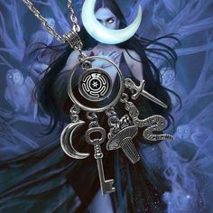 a woman with long black hair wearing a silver necklace and holding a key to the moon