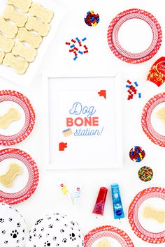 the dog bone station sign is surrounded by cookies and candies