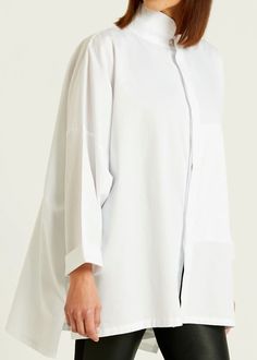 A timeless signature shirt is now available in Planet's fine cotton rib. Style features: a chic mandarin collar and front hidden pocket proven to be a true lifesaver. Details: Mandarin Collar Button Front Placket 100% Cotton Machine Wash Cold One Size (sizeless) White Tops With Concealed Placket And Relaxed Fit, White Relaxed Fit Tops With Concealed Placket, White Shirt With Hidden Button Closure For Spring, Spring Modern Shirt With Concealed Placket, Timeless Relaxed Fit Tops For Daywear, Modern Shirt With Concealed Placket For Spring, Modern Tops With Button Cuffs And Shirttail Hem, Classic Shirt With Relaxed Fit And Stand Collar, White Stand Collar Tops For Daywear