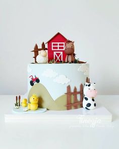 a cake with farm animals on top of it