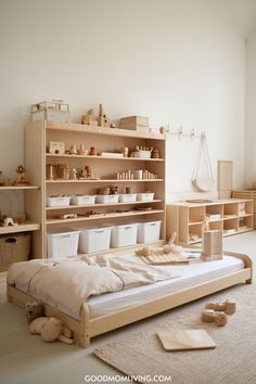 Cozy children's bedroom featuring a wooden bed, organized shelves with toys and storage bins, and a minimalist design for a warm and inviting atmosphere. Playground Basement, Indoor Playground Basement, Montessori Playroom Small Space, Play Corner Ideas, Kids Play Corner