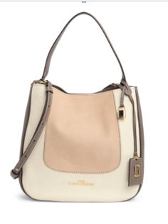 Elevate your everyday style with this chic Marc Jacobs The Director Leather Shoulder Bag in Beige. This authentic bag boasts a solid pattern with a magnetic closure and a spacious interior lined with beige fabric. The bag features a large size with dimensions of 13 inches in width, 12 inches in height, and 4 inches in depth. It comes with a brown leather handle/strap and exquisite gold hardware that adds a touch of elegance to your outfit. The bag's exterior is made of premium leather that guara Authentic Bags, Functional Accessories, Gold Hardware, Leather Handle, Leather Shoulder Bag, Marc Jacobs, Bags Handbags, Brown Leather, Everyday Fashion