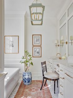 a white bathroom with blue and white decor