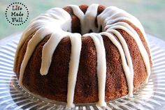 a bundt cake with white icing on a plate