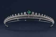 This tiara is beautifully silver-plated and encrusted with sparkling clear genuine zirconium stones of various sizes and a Single Emerald. The many zirconium Stones make this crown sparkle in any light and are prong set by hands! This piece is versatile and compliments many different styles, can be worn for Weddings, Bridal Showers, Birthdays, Baby Showers, Graduation, Maternity Shoots or any special occasions! Handmade Bridal Tiaras/Crown Made to Order Diamond Weight -- 8.75ct Diamond -- Americ Pretty Wedding Rings, Handmade Tiaras, Bridal Tiaras, Emerald Green Weddings, Tiara Bridal, Silver Tiara, Headpiece Jewelry, Crown Tiara, Diamond Crown