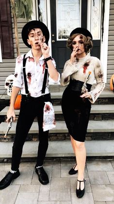 two people dressed up as zombies for halloween