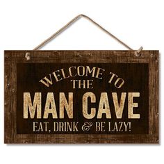 a wooden sign that says, welcome to the man cave eat drink and be lazy