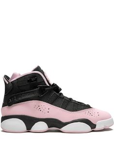 a pink and black sneaker with white outs