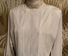 "Vintage 80s blouse by Michelle Stuart.  Size 8 Light silky weave with beautiful drape to it. 3 button closure at the back of neck.  Still has original shoulder pads (which can be snipped out if you want). Size tag is 8.  MEASUREMENTS: Armpit to armpit is 20\" across (so 37\" around) Shoulder to shoulder measures 16\" Sleeves measure 23\" long. ♥♥ I add daily to my shop  You can click the little blue ADD SHOP TO FAVORITES to the right of this listing, to see what I list each day.♥♥ ♥♥ For more v Formal Stretch Top With Buttons, Elegant Long Sleeve Evening Blouse, Elegant Stretch Blouse With Buttons, Elegant Stretch Blouse For Daywear, Elegant Long Sleeve Formal Blouse Piece, Elegant Fitted Blouse Piece For Evening, Elegant Fitted Evening Blouse Piece, Fitted Elegant Blouse Piece For Evening, Vintage Long Sleeve Padded Blouse