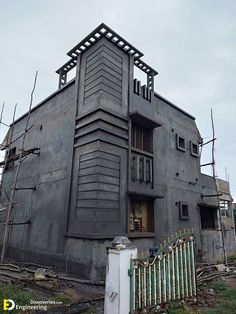 an old building with a clock tower on the top of it's roof and windows