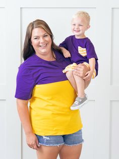 Unisex Purple & Gold Color Block Shirt Collegiate Team-colored Tops With Contrast Stripes, Short Sleeve Color Block Tops For College, Color Block Short Sleeve Tops For College, Collegiate Purple Top For Game Day, Collegiate Purple Cotton Tops, Purple Collegiate Cotton Tops, Purple Cotton Collegiate Tops, Multicolor Cotton Tops With Team Name, Purple Cotton T-shirt For Game Day