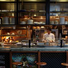 a chef preparing food in a restaurant kitchen