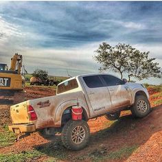 a truck that is sitting in the dirt