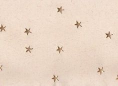 a white background with gold stars on it