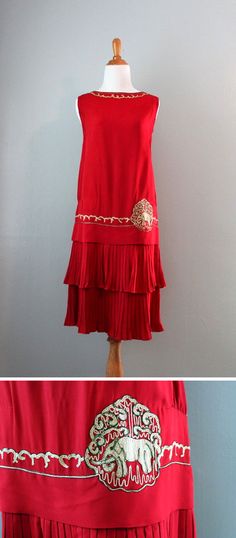 Dress ca. 1920s. Heavy red silk crepe or early rayon. Dropped waist over pleated, double flounced skirt. Neckline and waist trimmed with embroidery in off-white with metallic bronze trim. An elephant on one side of waist. Bodice lined in silk. HolliePoint/etsy Flounced Skirt, Elephant Applique, 1920's Fashion, Roaring 20's