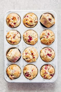 muffins with cranberry filling on a baking tray