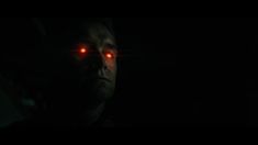 a man in the dark with red eyes and glowing lights on his face is staring into the distance