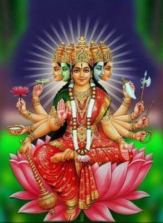 the hindu goddess sitting on top of a lotus flower with four other deities around her