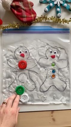 someone is making a snowman and two gingerbreads craft for kids to make