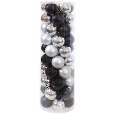 a vase filled with black and white ornaments