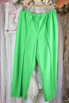 "*Vintage 70s Vibrant Green Pleated Trousers by Vera Neuman* Pre Loved Good Vintage Condition No Stains, Snags or Fade Vintage 70s Brand: Vera Material: 100% Polyester Green Pleated Trousers Pull-On Style High Waist Pleated Front Elastic Waist Bottom Single Stitch Cuffs Size Approx. X-Large Check the measurements for a better fit. Elastic Waist Waist: 32\" 37\" Around Stretched Inseam: 26 1/2\" Rise: 14\" High Hip: 42\" Around Low Hip: 44\" Around Thighs: 27\" Around Bottom Cuffs: 18\" Around Sh Vintage High Waist Solid Color Pants, Vintage Full Length Bottoms For Spring, Vintage Stretch Wide Leg Pants, Vintage Wide Leg Stretch Pants, Vintage Stretch Pants With Pockets, Vintage High Waist Stretch Pants, Retro Solid Color Bottoms For Spring, Retro Spring Bottoms, Vintage Spring Workwear Bottoms