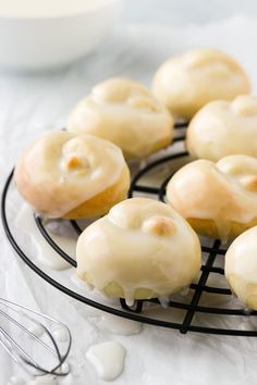 glazed donuts sitting on a wire rack