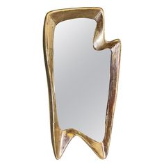 a mirror that is made out of wood and has a curved design on the side