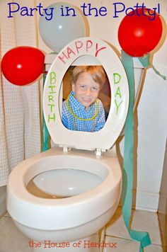 an image of a child's birthday photo on the toilet