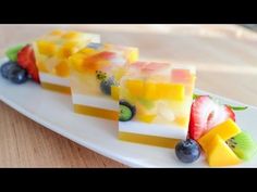 fruit slices are arranged on a white plate