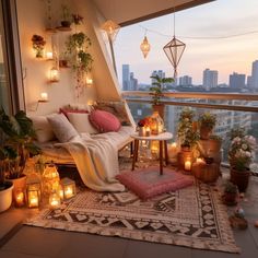 a balcony decorated with candles, plants and other decorating items for the night time