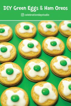 green eggs and ham oreos with white icing on a green tablecloth for st patrick's day